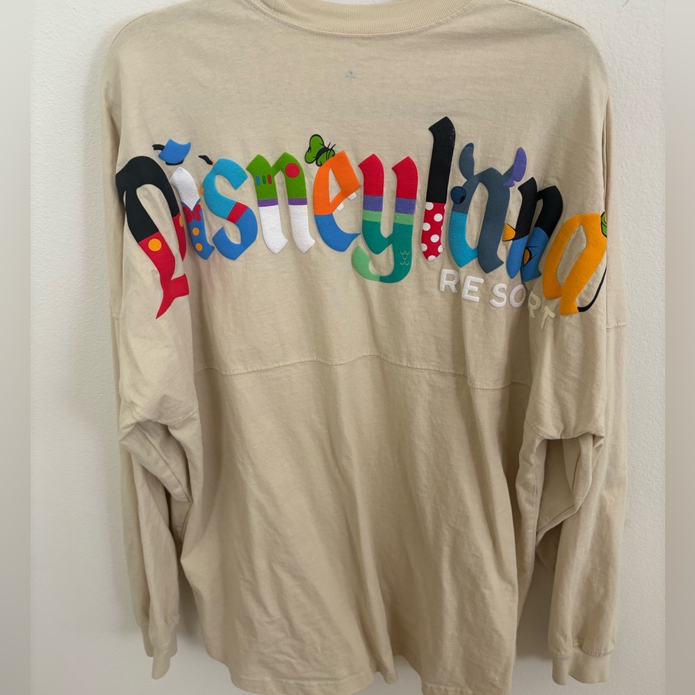 DISNEYLAND CREAM CHARACTER LETTERS SPIRIT JERSEY Size XL